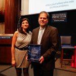 Brian Grow receiving the Shadid Award on behalf of his team in 2018. Shown here with Nada Bakri, Anthony Shadid's widow.