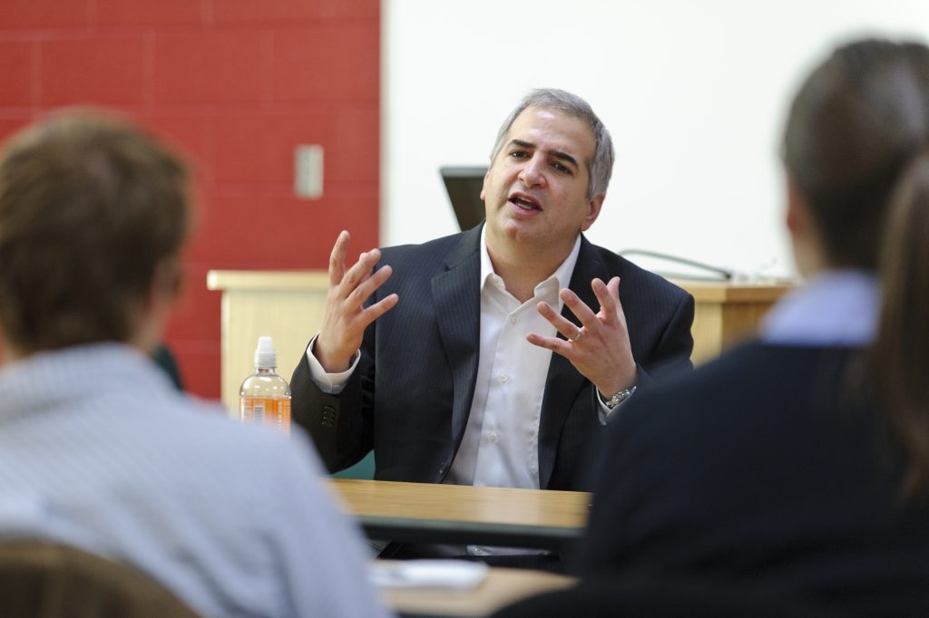 On Dec. 2, 2010, international correspondent for the New York Times Anthony Shadid (center) speaks to a group of journalism students in a Vilas Hall classroom at the University of Wisconsin-Madison. Shadid is a UW-Madison alumnus and two-time Pulitzer Prize winner. (Photo by Bryce Richter / UW-Madison)