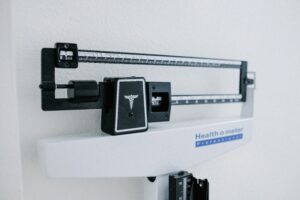 Clinical-looking white photograph of the top of a medical scale